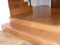 new hardwood landing and steps with ceramic tile flooring