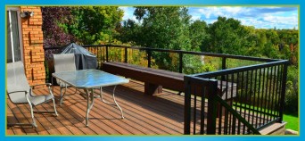 wooden deck with glass and metal railing